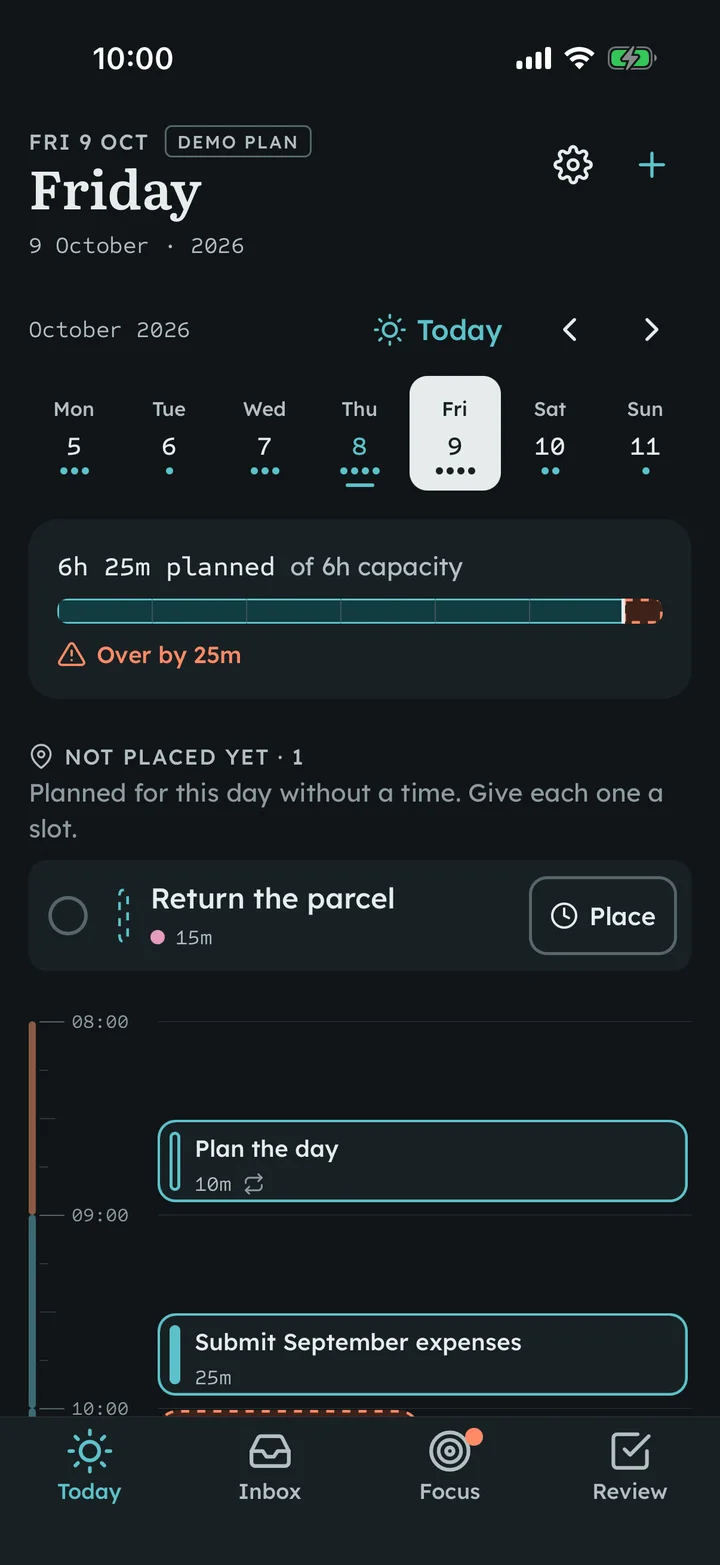 A day in dark mode on iOS with the week strip, capacity ruler, an unplaced task and the time ruler